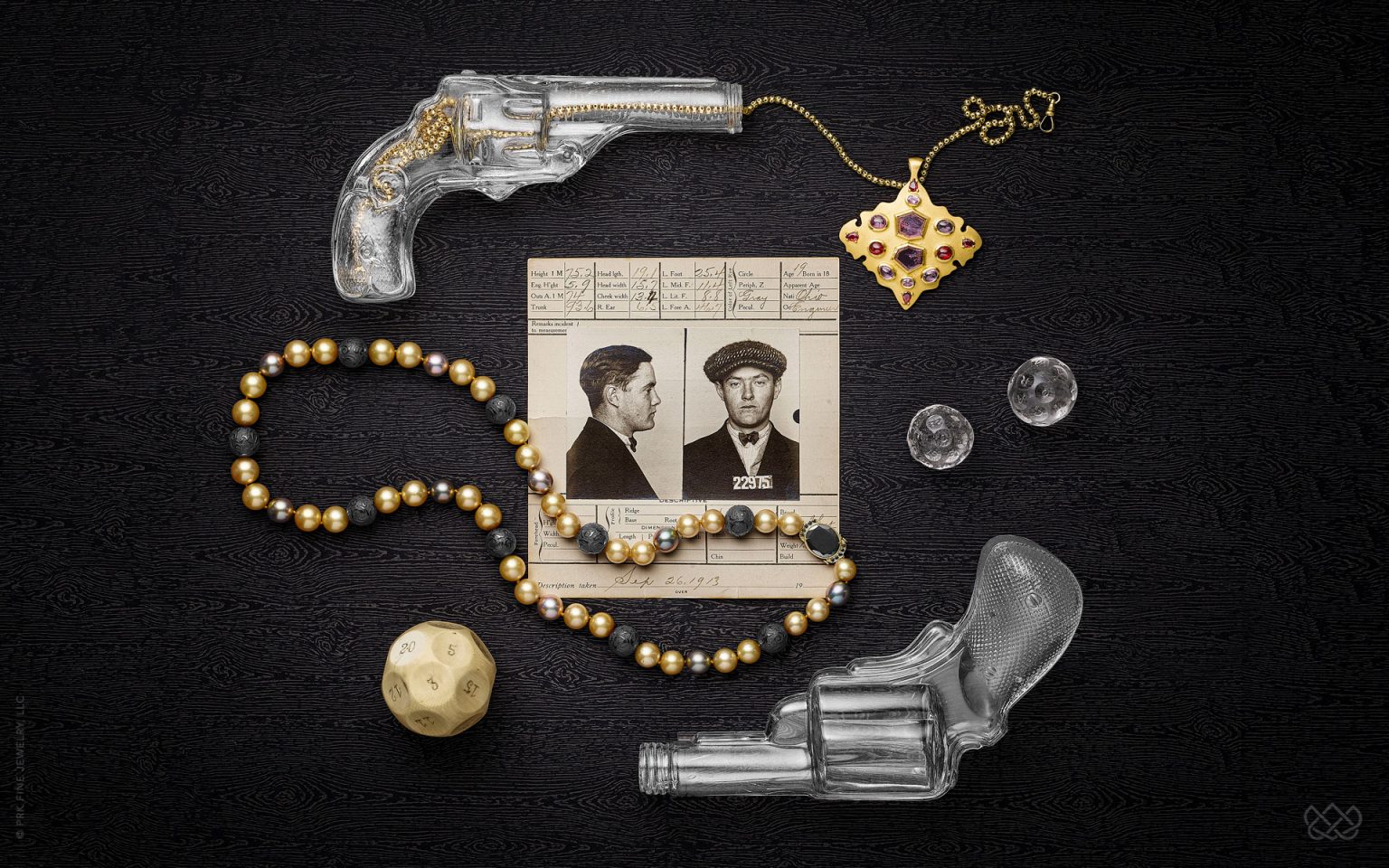 22k gold Moroccan style pendant studded with juicy, pomegranate seed-like rubies, red Burmese spinels, and pink and lavender sapphires. Hand-knotted Tahitian golden and gray pearl necklace with carved jet beads and 18k clasp with black diamonds.